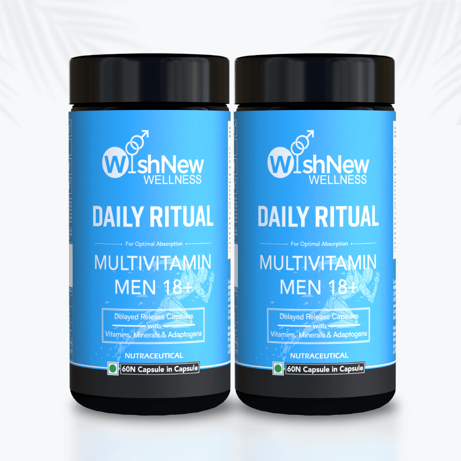 Image displaying two bottles of WishNew Wellness Daily Ritual Multivitamin Men 18+, placed side by side against a clean, light background with subtle leaf patterns. Each bottle highlights features like 'Delayed Release Capsules with Vitamins, Minerals & Adaptogens' and contains 60 capsules per bottle.